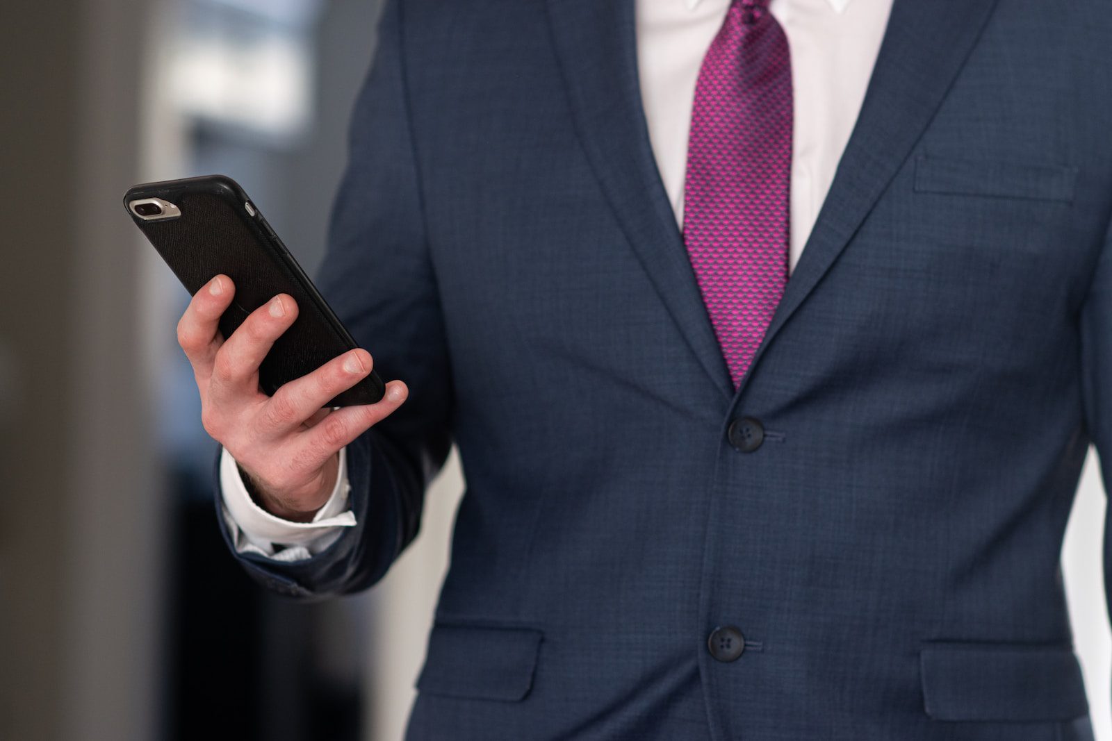 man in a suit on the phone