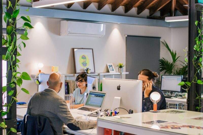 people using computers in an office