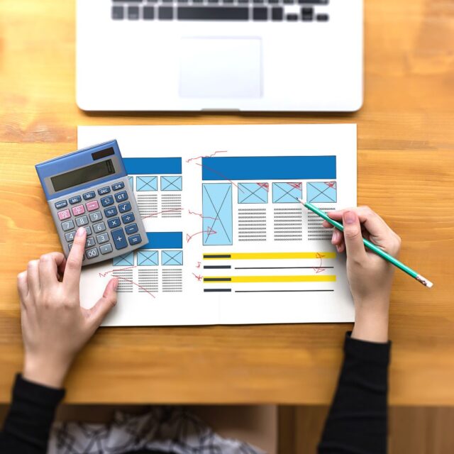 calculator and documents on a desk