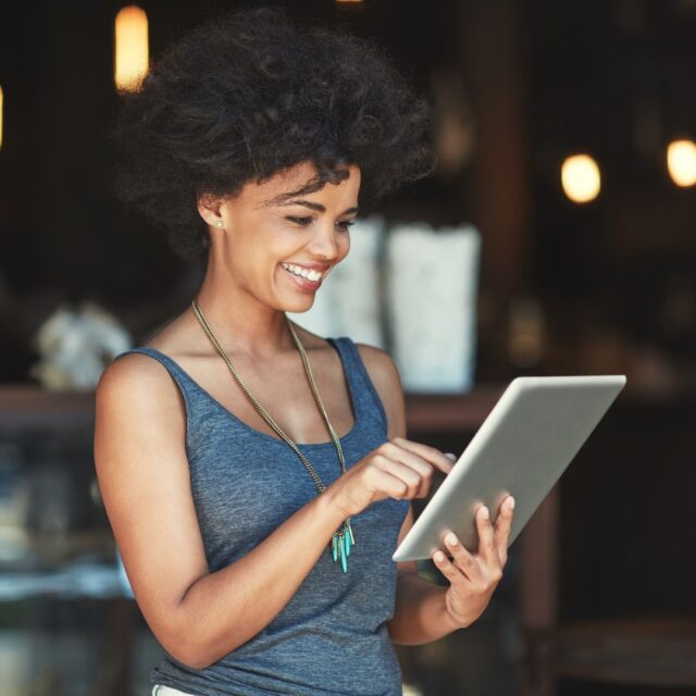 woman holding a tablet